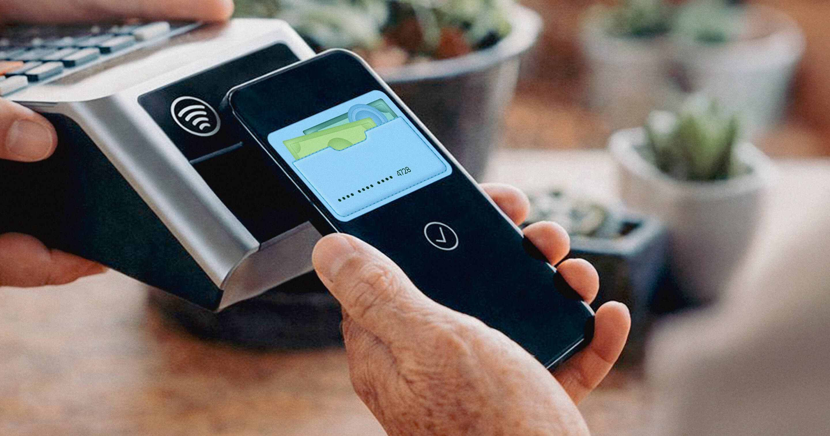 Close-up of a mobile phone paying with the Senda app through a card reader in a physical store, showing the digital card in a wallet.